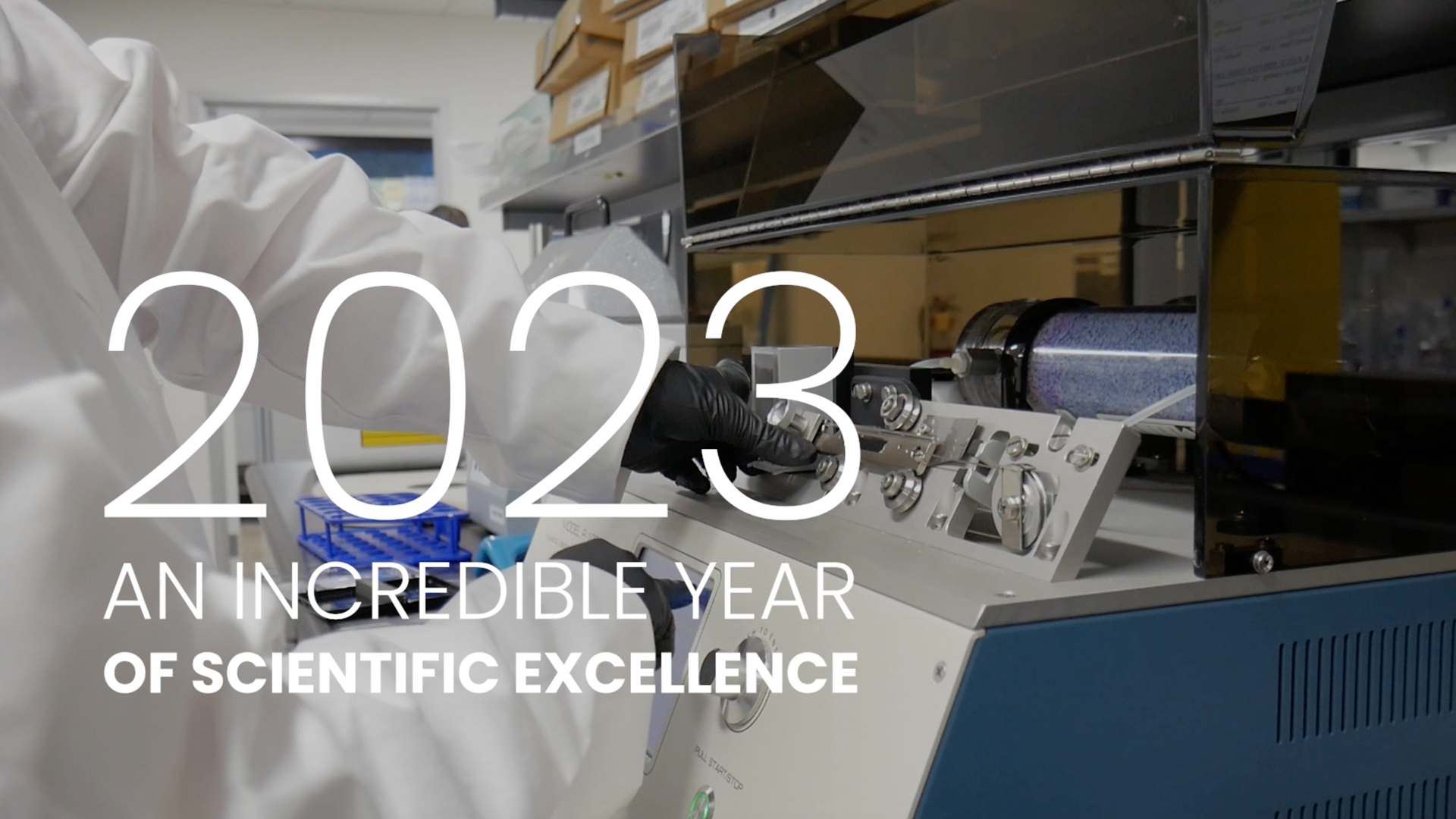 Background image of someone handling lab equipment